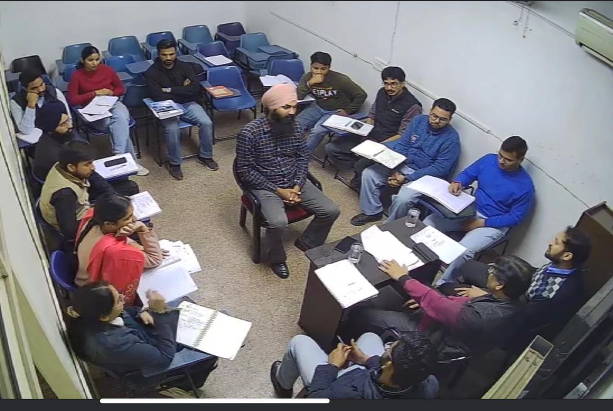 Students seated in a circle during an interactive personality development session at Panacea Bharti Institute